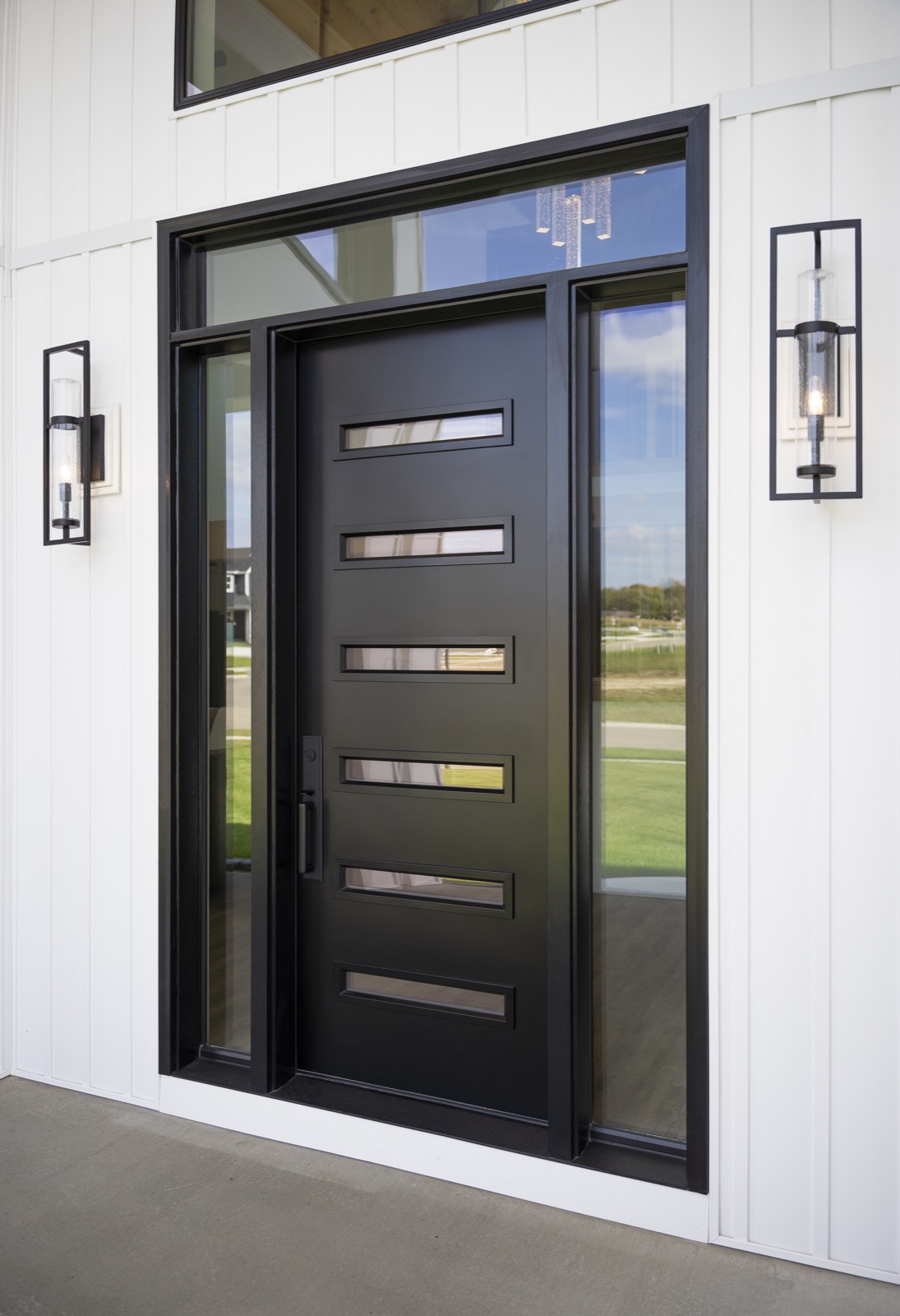 Custom black front door with sidelites and transom