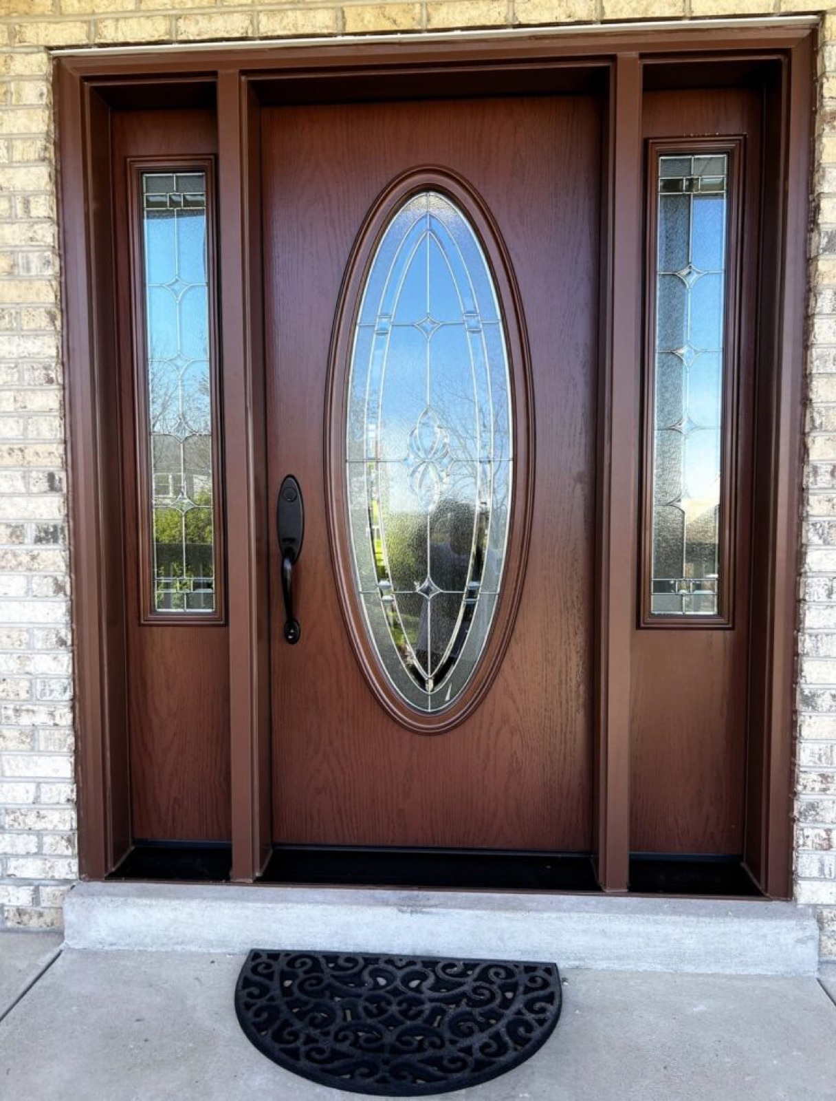 Classic oval glass entry door with sidelites