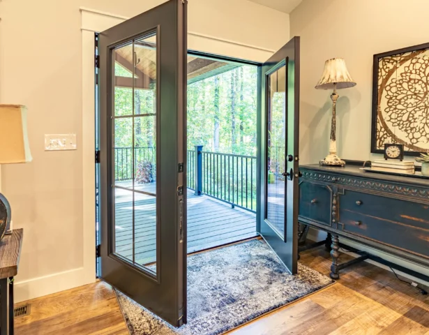 Interior view of exterior French doors opening to a deck
