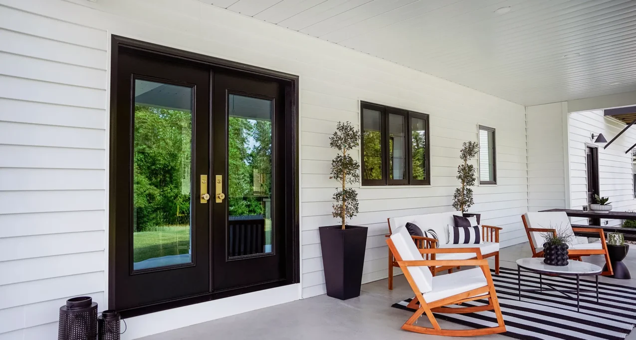 Coal Black exterior double doors on a covered porch