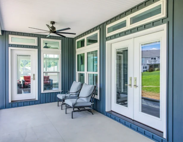 White exterior French doors with internal blinds on a covered patio