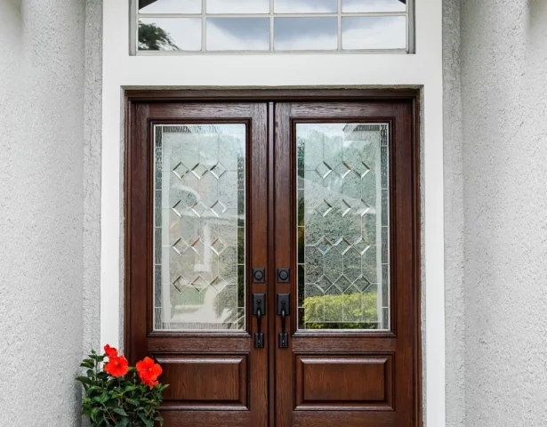 Oak exterior double doors with decorative glass and transom