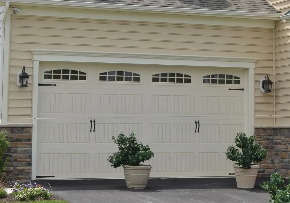 White residential garage door with decorative windows