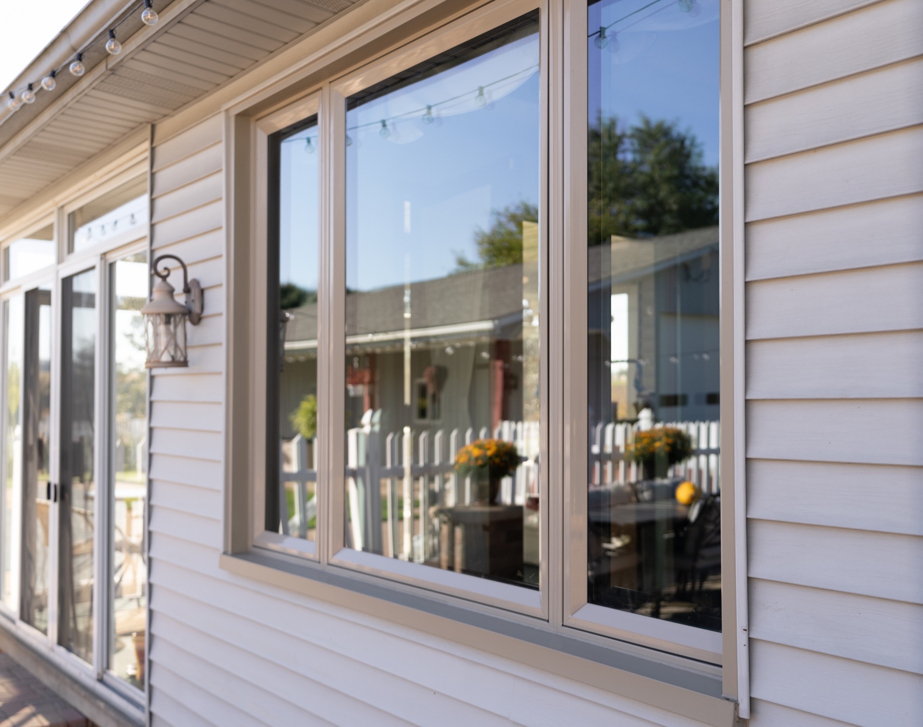 Cream replacement windows with clean exterior finishing